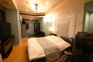 Televiisor ja/või meelelahutuskeskus majutusasutuses Hotel Allure (Adult Only)