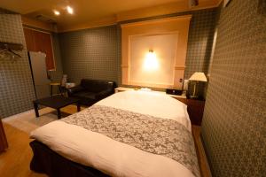 Voodi või voodid majutusasutuse Hotel Allure (Adult Only) toas