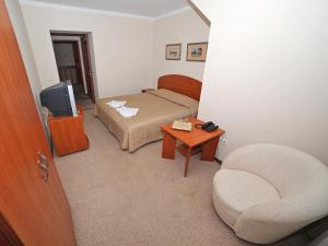 Ein Bett oder Betten in einem Zimmer der Unterkunft Deims Hotel