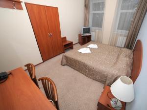 Ein Bett oder Betten in einem Zimmer der Unterkunft Deims Hotel