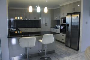A kitchen or kitchenette at Family Friendly Holiday Home
