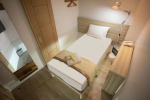 Postel nebo postele na pokoji v ubytování 1010 Hotel