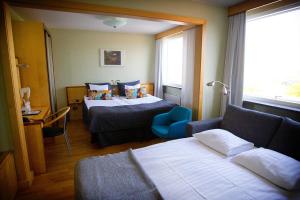 Postel nebo postele na pokoji v ubytování Hotell Aston
