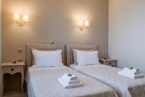 A bed or beds in a room at Kampaki Stone Houses