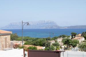 a view of the ocean from a city at Domus de Diana in Olbia