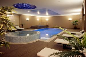 a large swimming pool in the middle of a room at Mercure Istanbul Altunizade in Istanbul