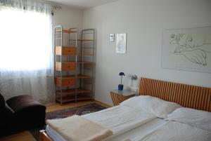 En eller flere senger på et rom på Appartements Oswald