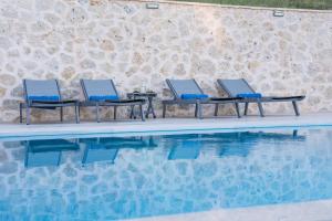 The swimming pool at or close to Kampaki Stone Houses