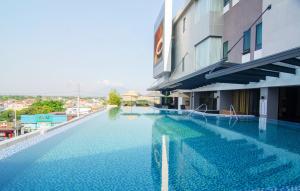 a large swimming pool next to a building at Best Western Plus Metro Clark in Angeles