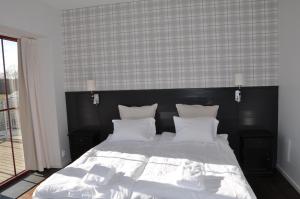 Postel nebo postele na pokoji v ubytování Hotel Bella Luna