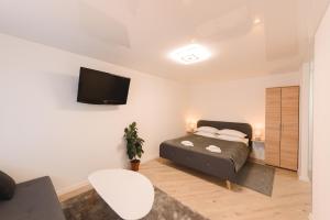 Posteľ alebo postele v izbe v ubytovaní M&M apartment