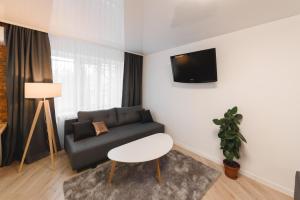Televízia a/alebo spoločenská miestnosť v ubytovaní M&M apartment
