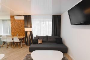 Televízia a/alebo spoločenská miestnosť v ubytovaní M&M apartment
