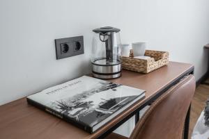 a book sitting on top of a table at Pensión H30 Bilbao in Bilbao