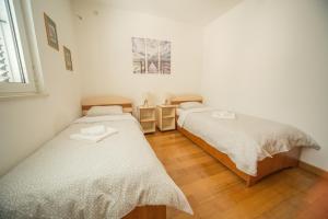 Кровать или кровати в номере ZEN Apartment Pržno