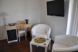 TV a/nebo společenská místnost v ubytování Hotel Bella Luna