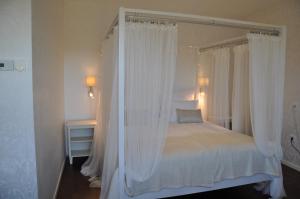 Postel nebo postele na pokoji v ubytování Hotel Bella Luna