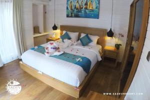Voodi või voodid majutusasutuse Sadev Resort toas