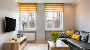 Telewizja i/lub zestaw kina domowego w obiekcie Maya's Flats & Resorts 19 & 20 - Ogarna