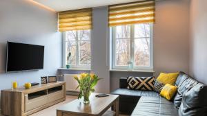 Telewizja i/lub zestaw kina domowego w obiekcie Maya's Flats & Resorts 19 & 20 - Ogarna