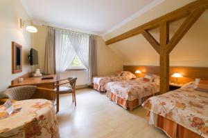 Postel nebo postele na pokoji v ubytování Lech Resort & Spa