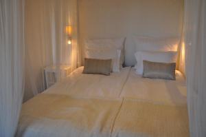 Postel nebo postele na pokoji v ubytování Hotel Bella Luna