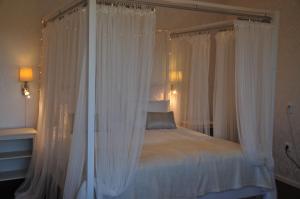 Postel nebo postele na pokoji v ubytování Hotel Bella Luna