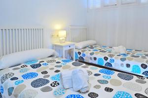 Postel nebo postele na pokoji v ubytování MyFlats Azul