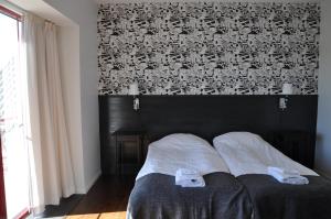 Postel nebo postele na pokoji v ubytování Hotel Bella Luna