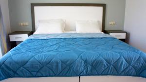 A bed or beds in a room at Studios Magda
