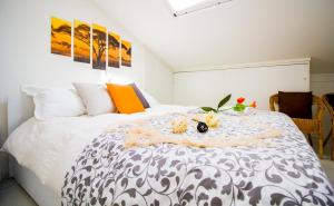 a bedroom with a large white bed with flowers on it at InnPisaRentals2 - Airstation Central Flat in Pisa