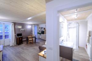 a room with a kitchen and a living room at Il borghetto di Torno in Torno +75 photos