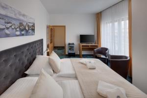 TV a/nebo společenská místnost v ubytování Hotel Oya