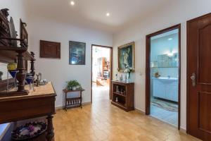 a living room with a staircase and a bathroom at Casa da Praia in Costa da Caparica