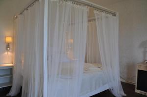 Postel nebo postele na pokoji v ubytování Hotel Bella Luna