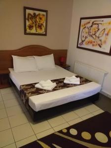 Postel nebo postele na pokoji v ubytování Hotel Tranzzit