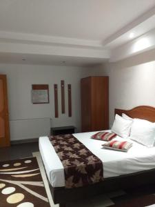 Postel nebo postele na pokoji v ubytování Hotel Tranzzit