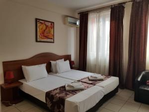Postel nebo postele na pokoji v ubytování Hotel Tranzzit