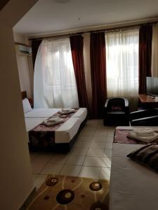 Postel nebo postele na pokoji v ubytování Hotel Tranzzit