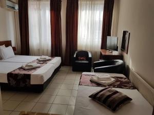 Postel nebo postele na pokoji v ubytování Hotel Tranzzit