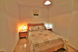 A bed or beds in a room at Apartamento Añon