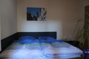 Кровать или кровати в номере Gästewohnung Müntzer
