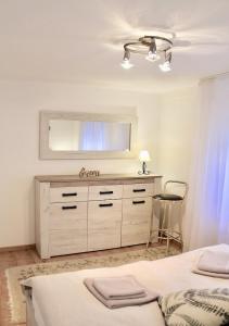 Postel nebo postele na pokoji v ubytování Apartment Queen