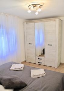 Postel nebo postele na pokoji v ubytování Apartment Queen