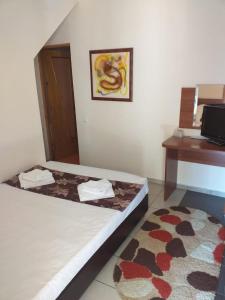 Postel nebo postele na pokoji v ubytování Hotel Tranzzit