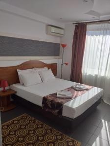 Postel nebo postele na pokoji v ubytování Hotel Tranzzit