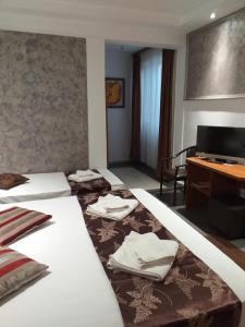 Postel nebo postele na pokoji v ubytování Hotel Tranzzit