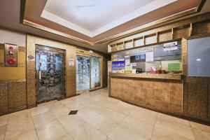 a lobby of a restaurant with a door and a counter at K2 Motel in Seoul