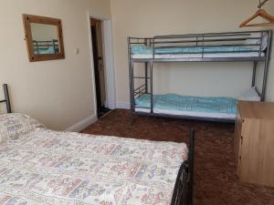 A bunk bed or bunk beds in a room at Glencoe 