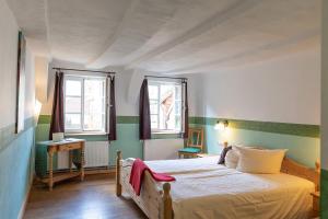 Postel nebo postele na pokoji v ubytování Hotel Aegidienhof